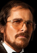 Christian Bale as Irving Rosenfeld