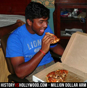 Dinesh Patel eating pizza